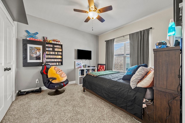 carpeted bedroom with ceiling fan