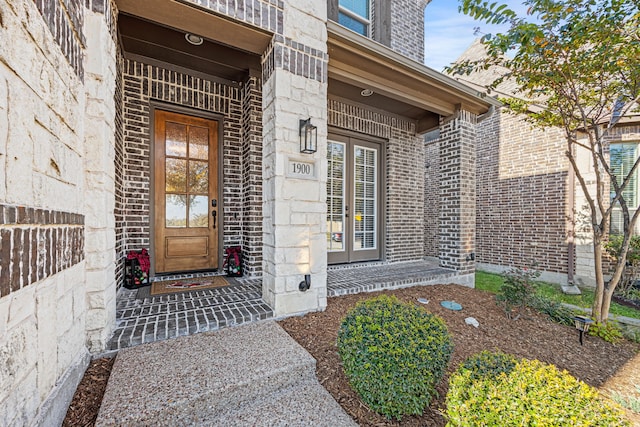doorway to property with brick siding