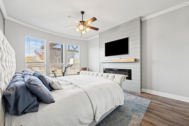 bedroom with ceiling fan, baseboards, ornamental molding, a fireplace, and wood finished floors