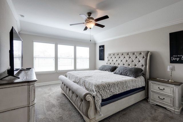 carpeted bedroom featuring a raised ceiling, ceiling fan, and crown molding