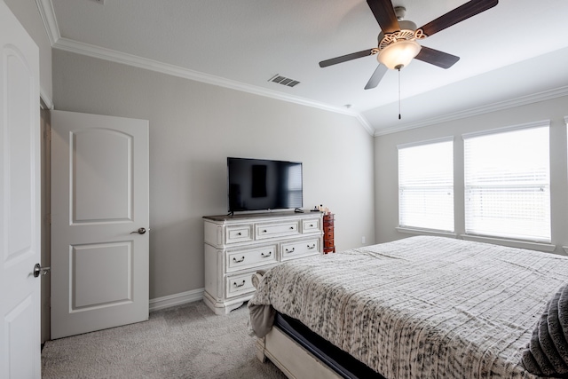 carpeted bedroom featuring vaulted ceiling, ceiling fan, and crown molding