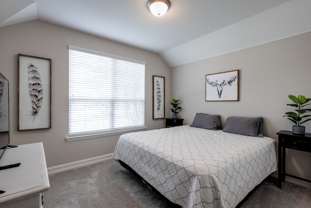 carpeted bedroom with vaulted ceiling