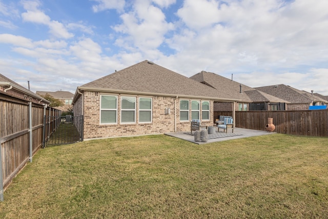 rear view of house with an outdoor hangout area, a yard, and a patio