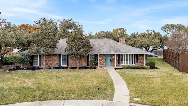 single story home featuring a front yard