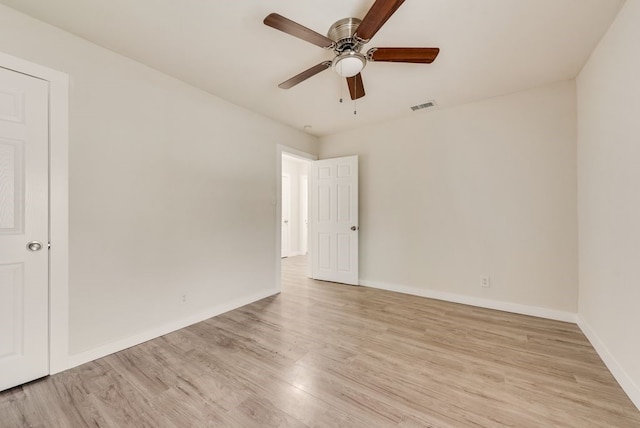 spare room featuring ceiling fan and light hardwood / wood-style flooring