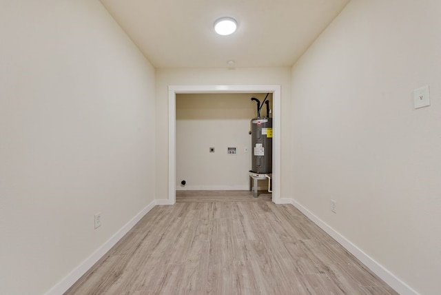 2233 Eastover Ave, Fort Worth, TX 76105 - laundry area with electric water heater, hookup for an electric dryer, light wood finished floors, and hookup for a washing machine