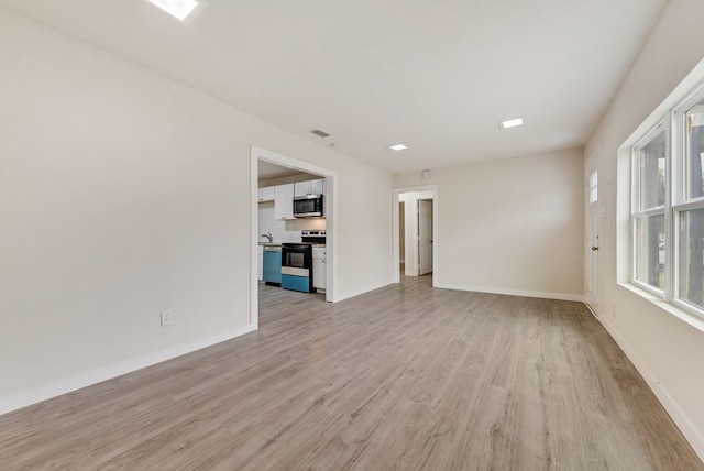 2233 Eastover Ave, Fort Worth, TX 76105 - unfurnished living room with light wood finished floors