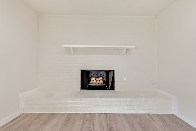 room details with a fireplace and wood-type flooring