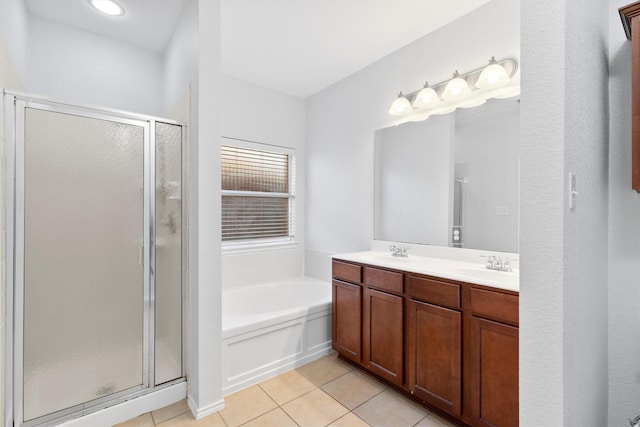 bathroom with tile patterned flooring, vanity, and independent shower and bath