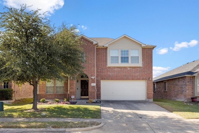 view of front of property featuring a garage and a front yard