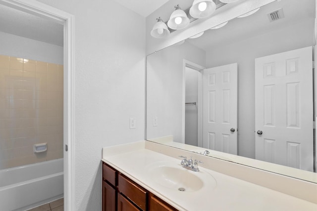 bathroom with vanity, tile patterned floors, and shower / bath combination