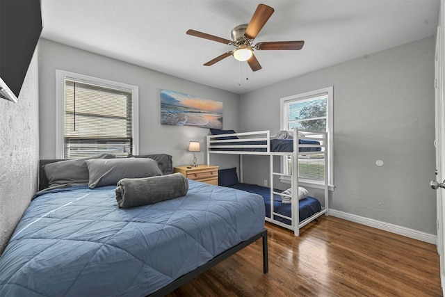 bedroom featuring ceiling fan and dark hardwood / wood-style flooring