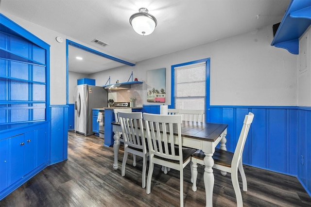 dining area featuring dark hardwood / wood-style floors