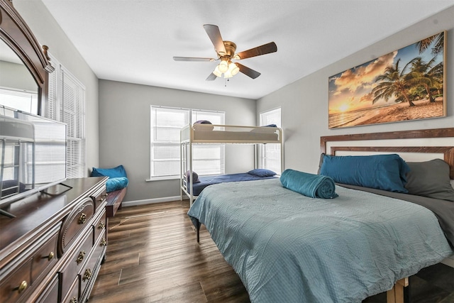 bedroom featuring ceiling fan and dark wood-type flooring