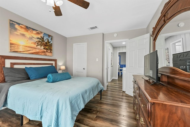 bedroom with ceiling fan and dark hardwood / wood-style floors