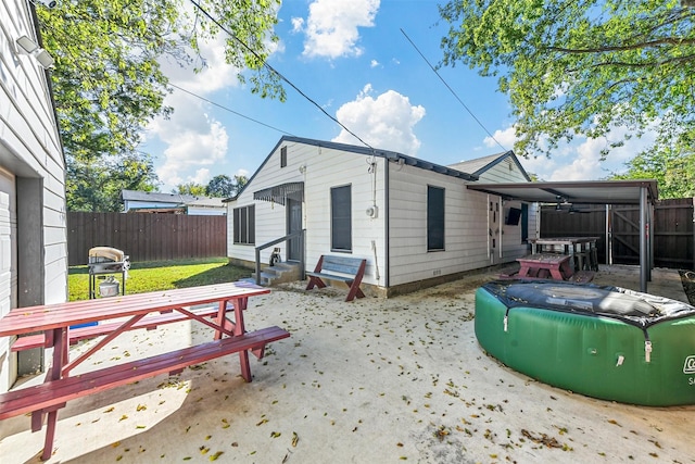 back of house with a patio