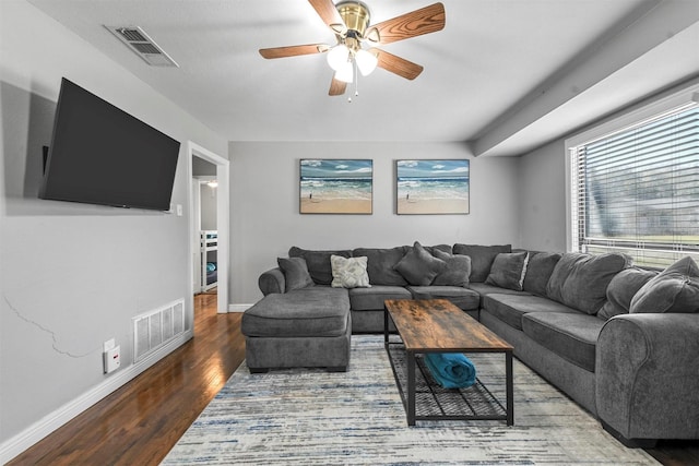 living room featuring ceiling fan and wood-type flooring