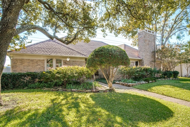 ranch-style house with a front lawn