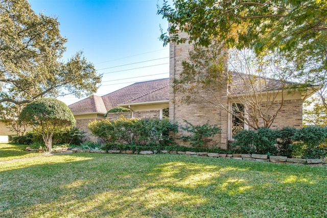 exterior space with a lawn