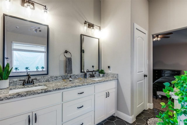 bathroom with tile patterned floors, ceiling fan, and vanity