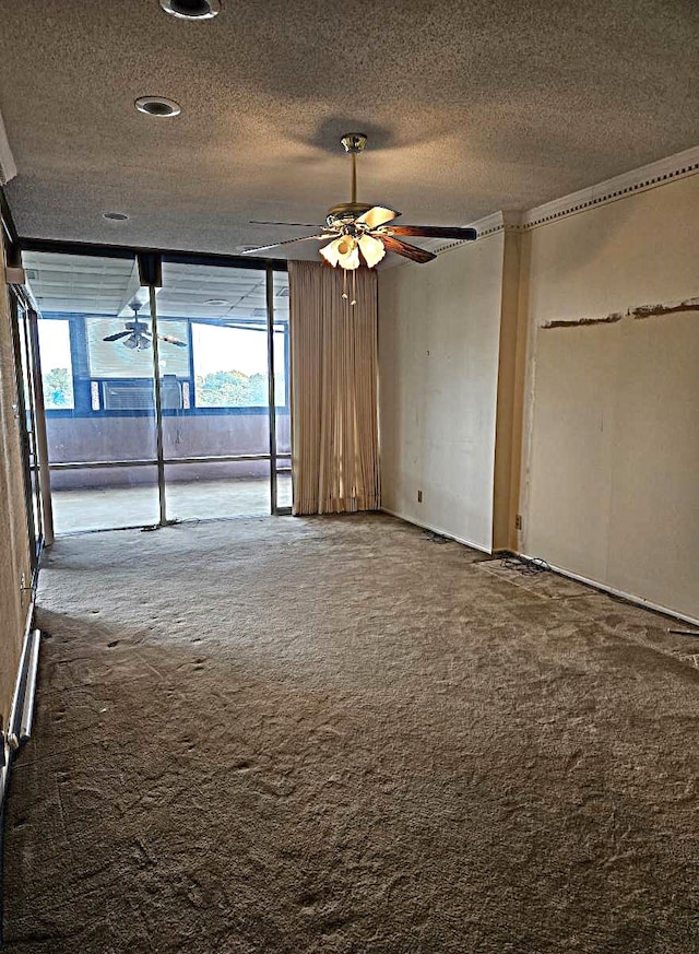 interior space with ceiling fan and a textured ceiling