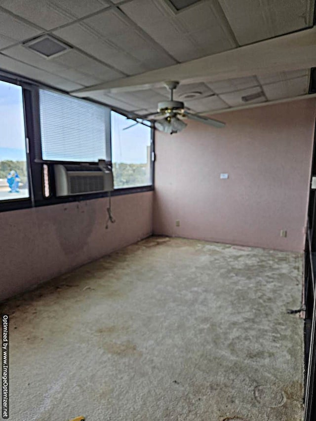 empty room with a drop ceiling and cooling unit