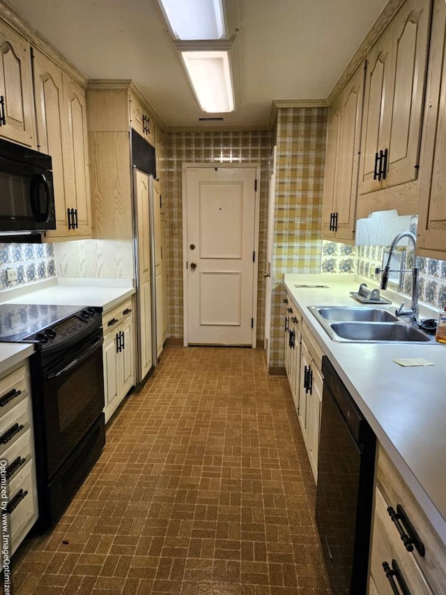 kitchen with black appliances, decorative backsplash, light brown cabinets, and sink