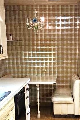 kitchen featuring crown molding, dishwasher, and a chandelier