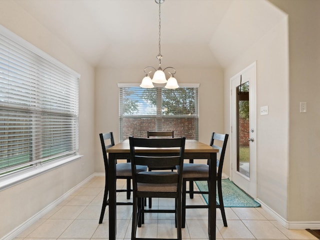 tiled dining space with a chandelier