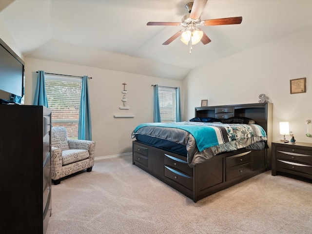 carpeted bedroom featuring ceiling fan and lofted ceiling