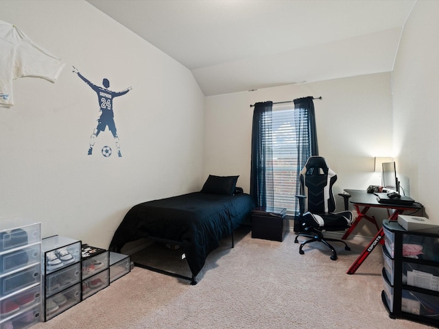 bedroom with light colored carpet and lofted ceiling