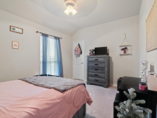 bedroom with ceiling fan, light carpet, and lofted ceiling