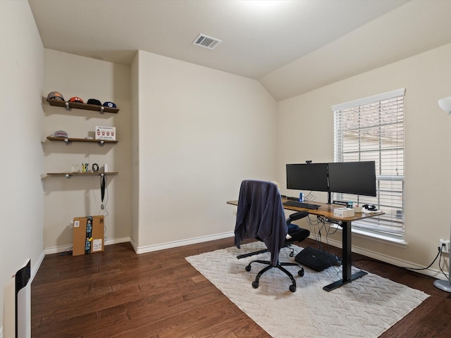 office area with dark hardwood / wood-style floors and lofted ceiling