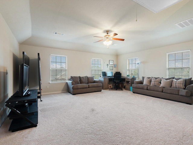 living room featuring carpet, plenty of natural light, ceiling fan, and vaulted ceiling