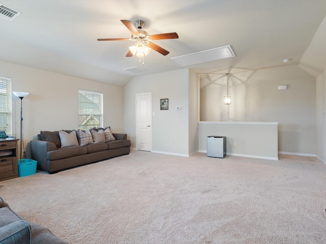 living room with ceiling fan, light colored carpet, and vaulted ceiling