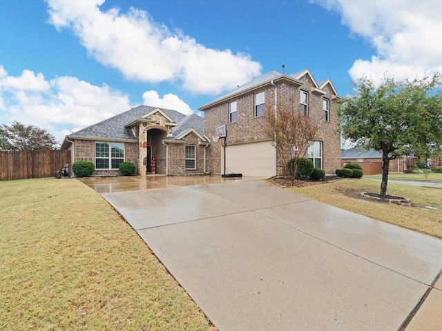 view of front of home featuring a front yard and a garage