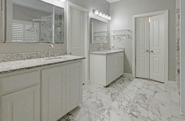 bathroom with vanity and a shower with shower door