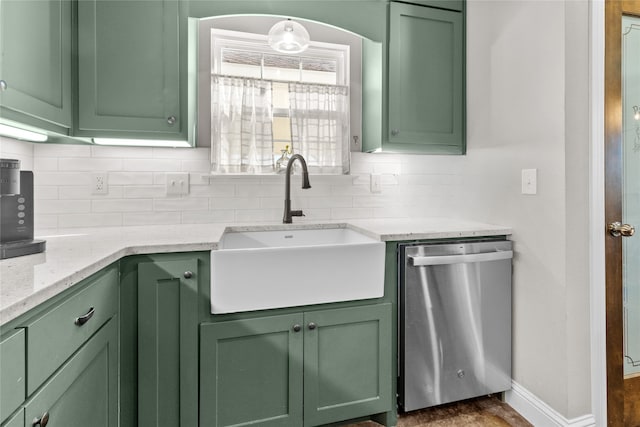 kitchen with dishwasher, decorative backsplash, green cabinets, and sink