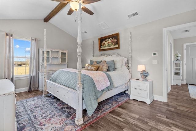 bedroom featuring dark wood-type flooring, vaulted ceiling with beams, and ceiling fan