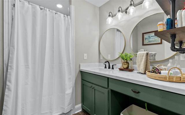 bathroom with vanity and hardwood / wood-style flooring