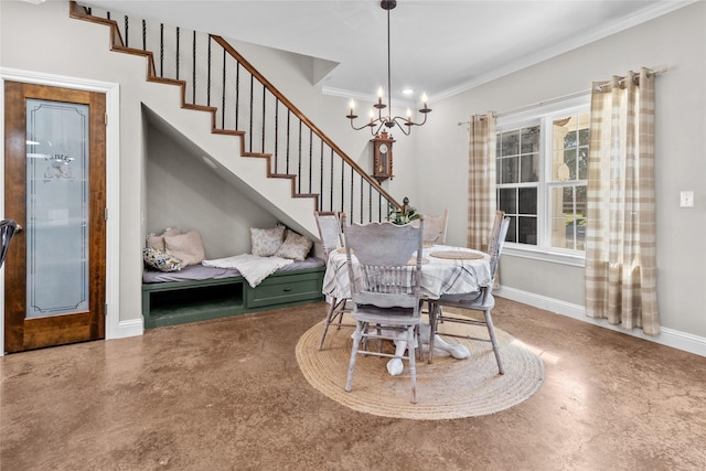 dining area featuring ornamental molding and a chandelier