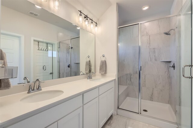 bathroom with vanity and walk in shower