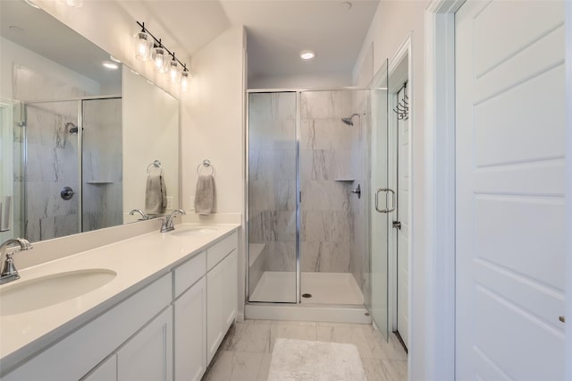 bathroom with vanity and an enclosed shower