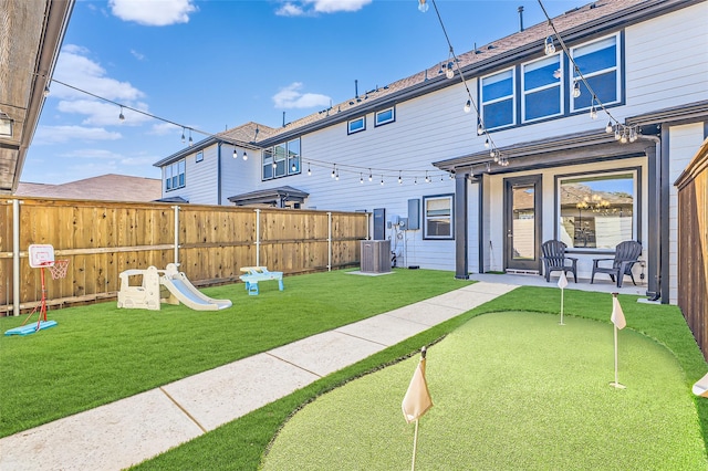 back of property featuring central AC unit and a patio