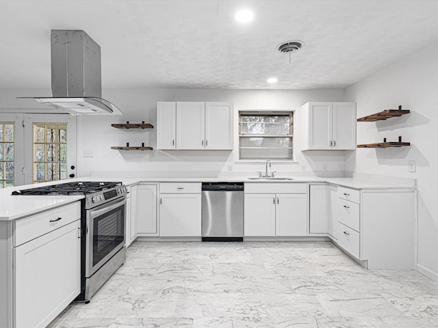 kitchen featuring sink, white cabinets, a healthy amount of sunlight, and appliances with stainless steel finishes