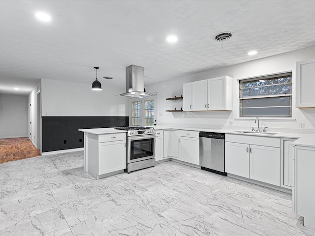 kitchen with pendant lighting, sink, island range hood, kitchen peninsula, and stainless steel appliances