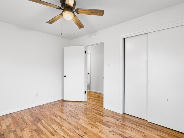 unfurnished bedroom with light wood-type flooring and ceiling fan