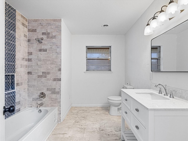 full bathroom with vanity, tiled shower / bath combo, and toilet