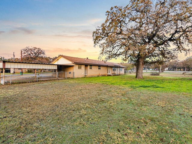 view of yard at dusk