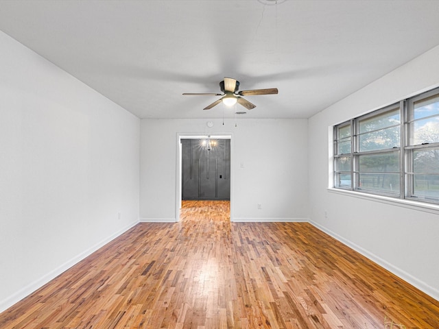 spare room with ceiling fan and light hardwood / wood-style floors